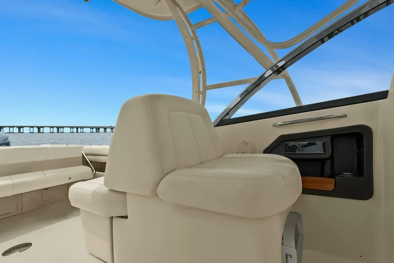 Patsy Ru Yacht Photos Pics 2016 Grady-White 285 Freedom boat interior with beige seating and ocean view.