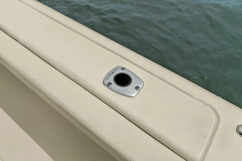 Patsy Ru Yacht Photos Pics 2016 Grady-White 285 Freedom boat detail with rod holder, near water.