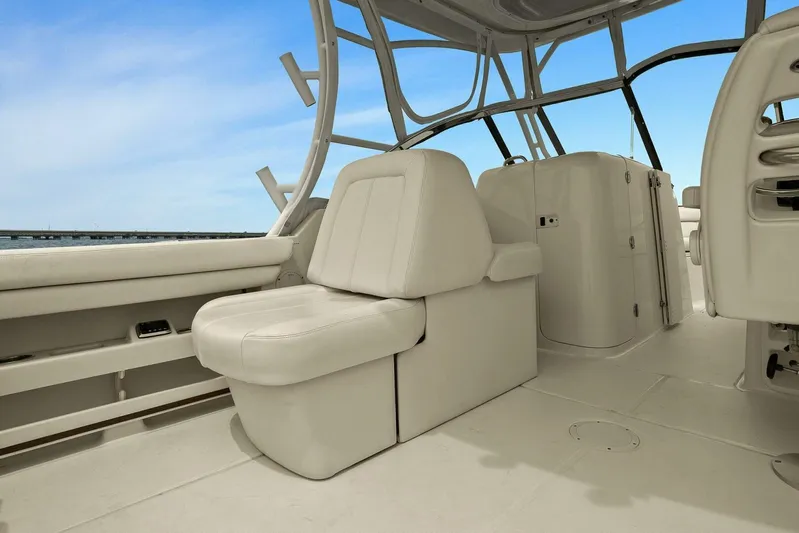 Patsy Ru Yacht Photos Pics 2016 Grady-White 285 Freedom boat interior with cushioned seating and open deck.
