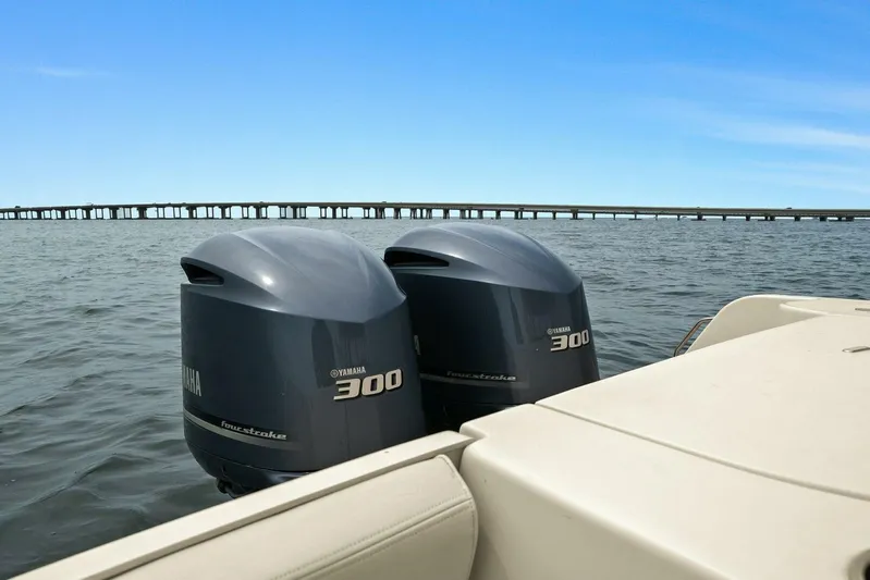 Patsy Ru Yacht Photos Pics Twin Yamaha 300 outboard engines on a 2016 Grady-White 285 Freedom boat, ocean backdrop.
