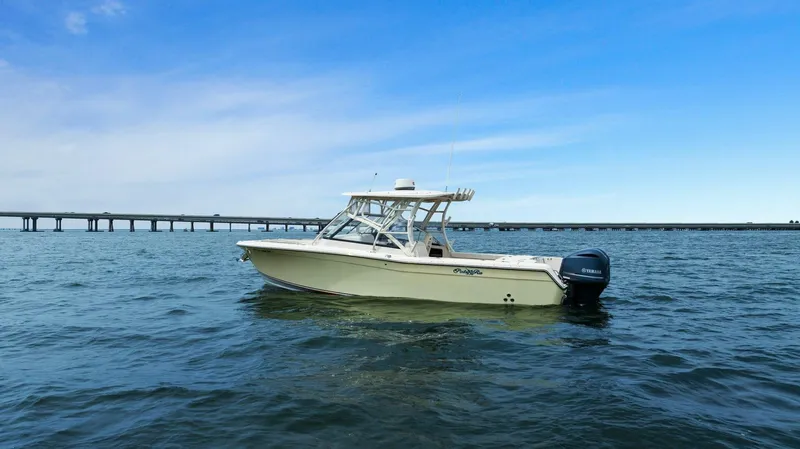 Patsy Ru Yacht Photos Pics 2016 Grady-White 285 Freedom boat on open water with clear blue sky.