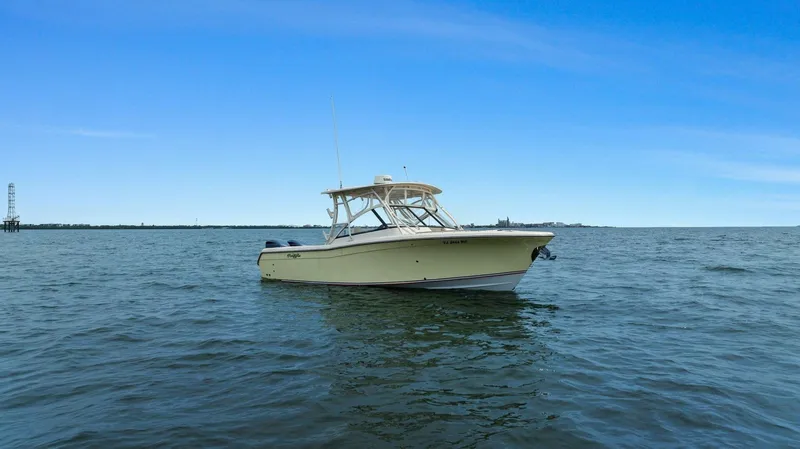 Patsy Ru Yacht Photos Pics 2016 Grady-White 285 Freedom boat on open water under clear blue sky.