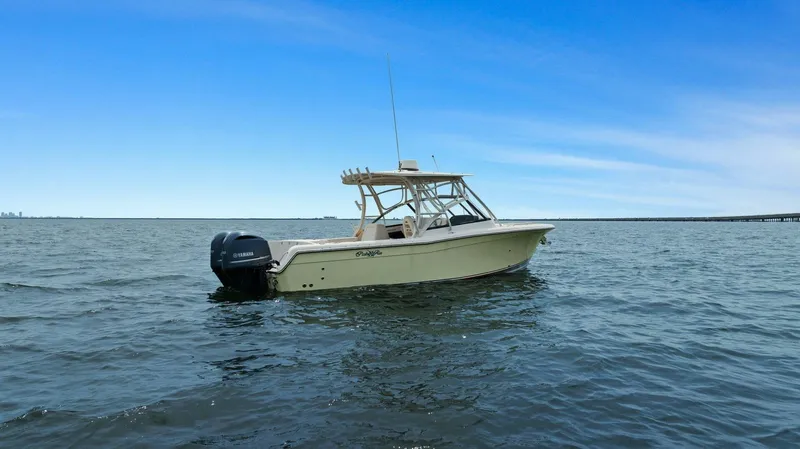 Patsy Ru Yacht Photos Pics 2016 Grady-White 285 Freedom boat on open water under clear blue sky.