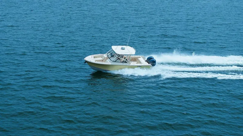 Patsy Ru Yacht Photos Pics 2016 Grady-White 285 Freedom boat cruising on open water.