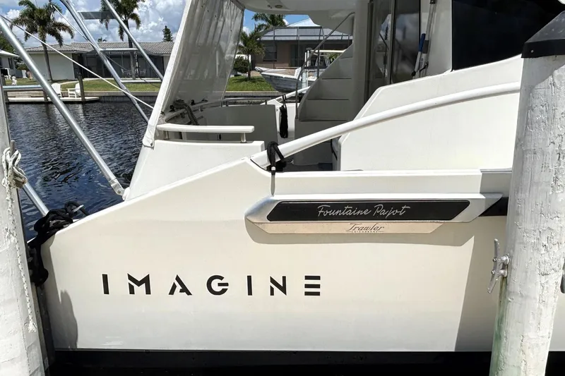 Imagine Yacht Photos Pics 2000 Fountaine Pajot Maryland 37 yacht docked, featuring "Imagine" on the side.