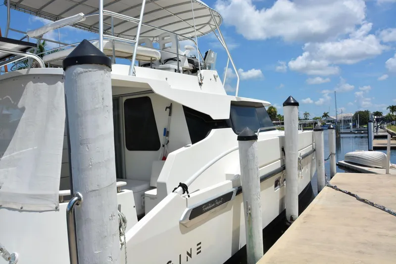 Imagine Yacht Photos Pics Fountaine Pajot Maryland 37 yacht docked at marina, clear sky, 2000 model.