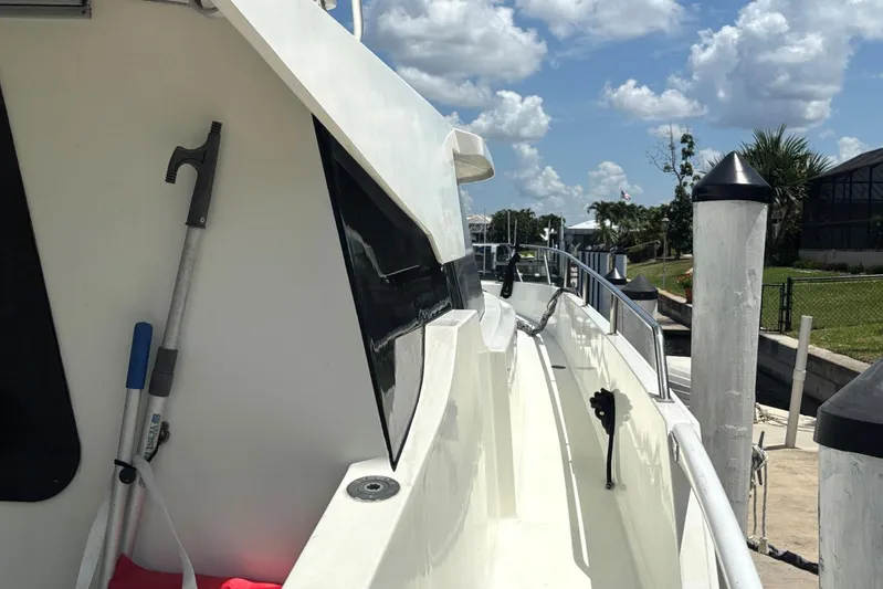 Imagine Yacht Photos Pics Fountaine Pajot Maryland 37 yacht docked, side view with clear sky, year 2000.