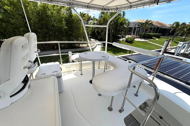 Imagine Yacht Photos Pics Flybridge of 2000 Fountaine Pajot Maryland 37 yacht with seating and table.