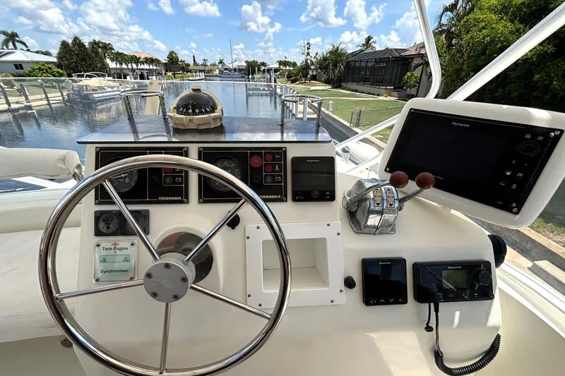 Imagine Yacht Photos Pics Helm of 2000 Fountaine Pajot Maryland 37 with navigation instruments and controls.