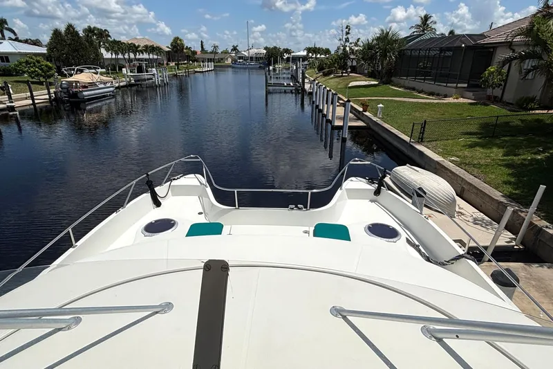 Imagine Yacht Photos Pics Fountaine Pajot Maryland 37 yacht docked in a scenic canal, 2000 model.