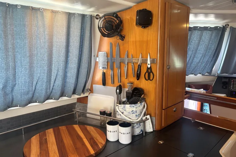 Imagine Yacht Photos Pics Galley of 2000 Fountaine Pajot Maryland 37 with knives and utensils organized.