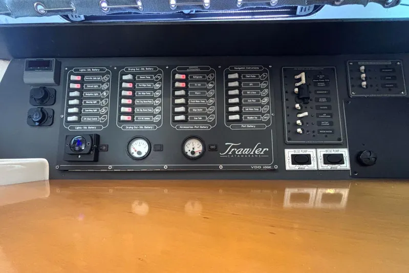 Imagine Yacht Photos Pics Control panel of a 2000 Fountaine Pajot Maryland 37 catamaran, featuring various switches and gauges.