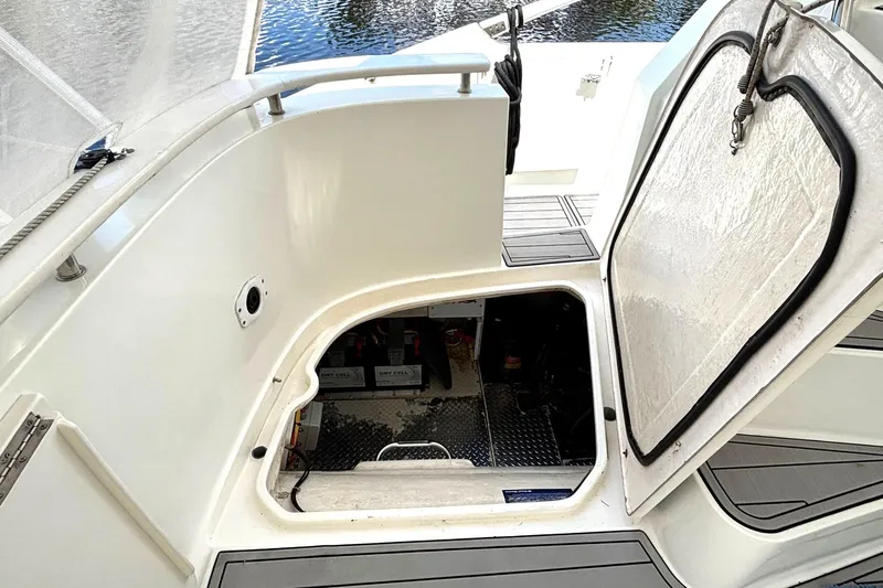 Imagine Yacht Photos Pics Open hatch on 2000 Fountaine Pajot Maryland 37, revealing engine compartment.
