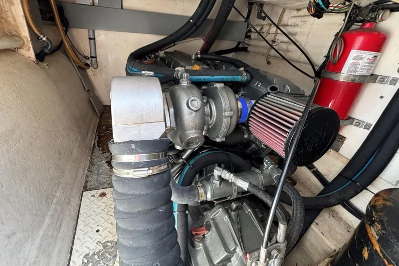 Imagine Yacht Photos Pics Engine room of 2000 Fountaine Pajot Maryland 37 with visible components and fire extinguisher.