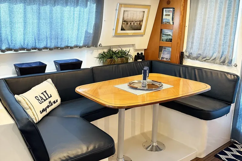 Imagine Yacht Photos Pics Interior of 2000 Fountaine Pajot Maryland 37 yacht with cozy dining area.