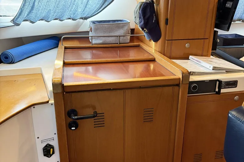 Imagine Yacht Photos Pics Interior of 2000 Fountaine Pajot Maryland 37 yacht with wooden cabinetry and accessories.