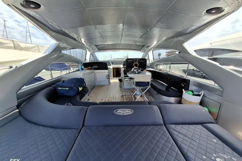 Domale Yacht Photos Pics Luxurious 2009 Pershing 56 yacht interior with spacious seating and modern amenities.