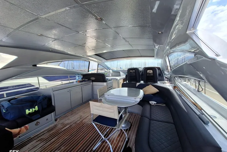 Domale Yacht Photos Pics Luxurious 2009 Pershing 56 yacht interior with sleek seating and modern design.