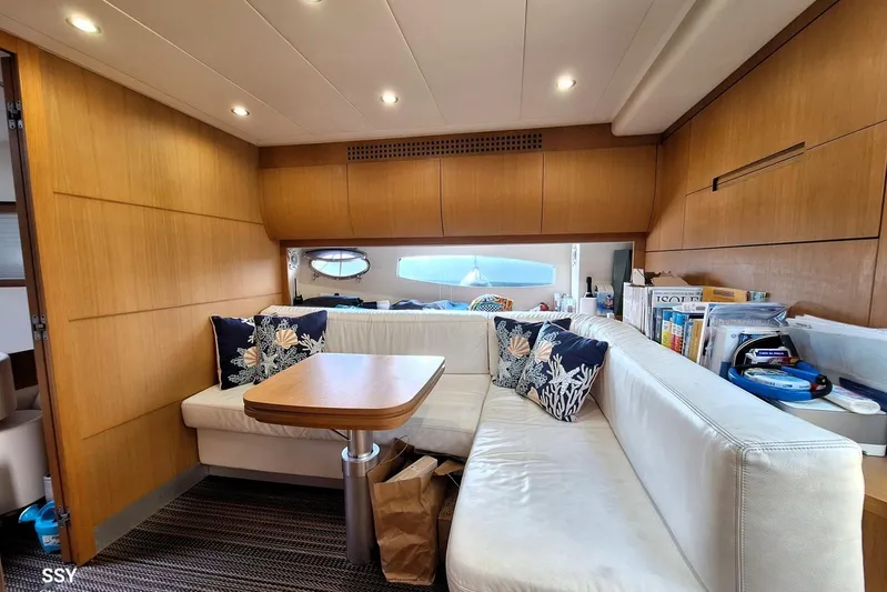 Domale Yacht Photos Pics Luxurious interior of 2009 Pershing 56 yacht with cozy seating and elegant decor.