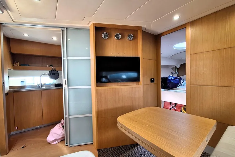 Domale Yacht Photos Pics Luxurious interior of a 2009 Pershing 56 yacht with modern wood finishes.
