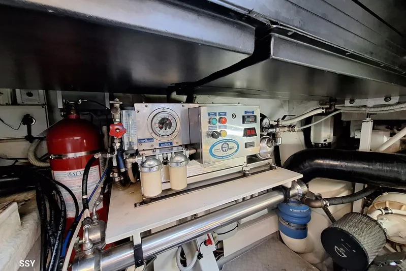 Domale Yacht Photos Pics Engine room of a 2009 Pershing 56 yacht with control panel and fire suppression system.