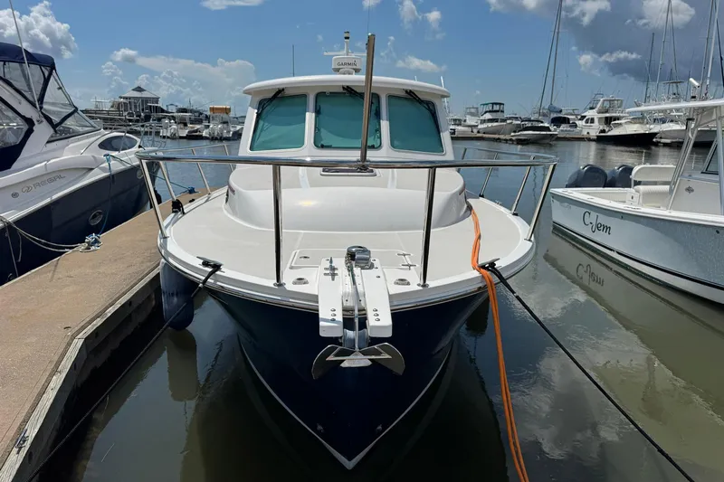 Mary Time Yacht Photos Pics 2013 Back Cove 30 boat docked at marina under blue sky.