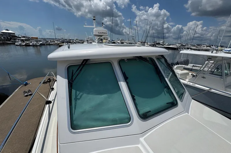 Mary Time Yacht Photos Pics 2013 Back Cove 30 boat docked at marina under cloudy sky.