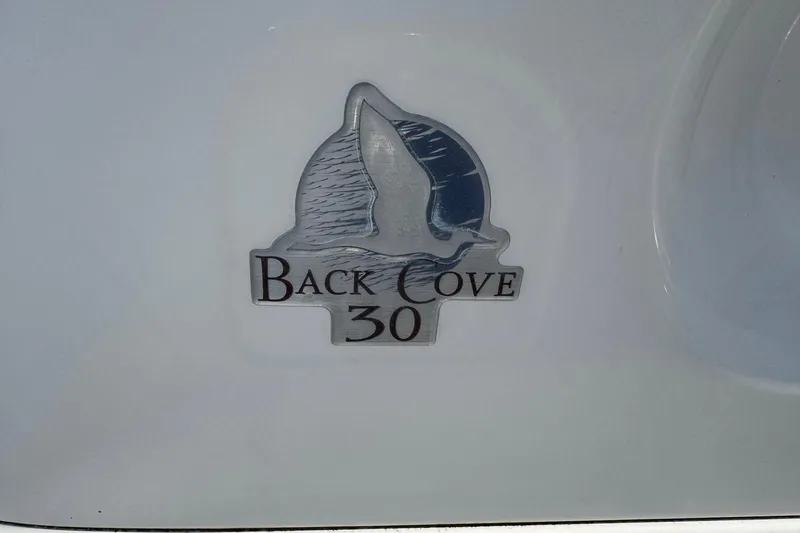 Mary Time Yacht Photos Pics 2013 Back Cove 30 logo on a boat's hull.