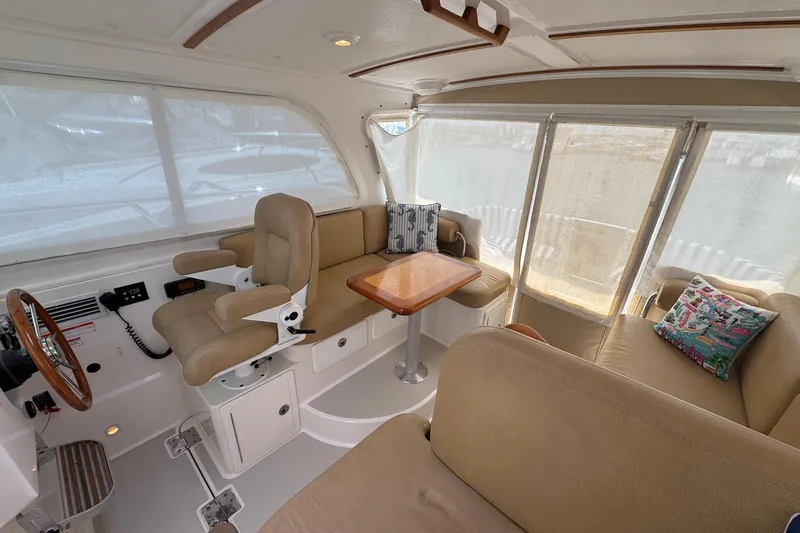 Mary Time Yacht Photos Pics Interior of 2013 Back Cove 30 boat with seating and helm station.