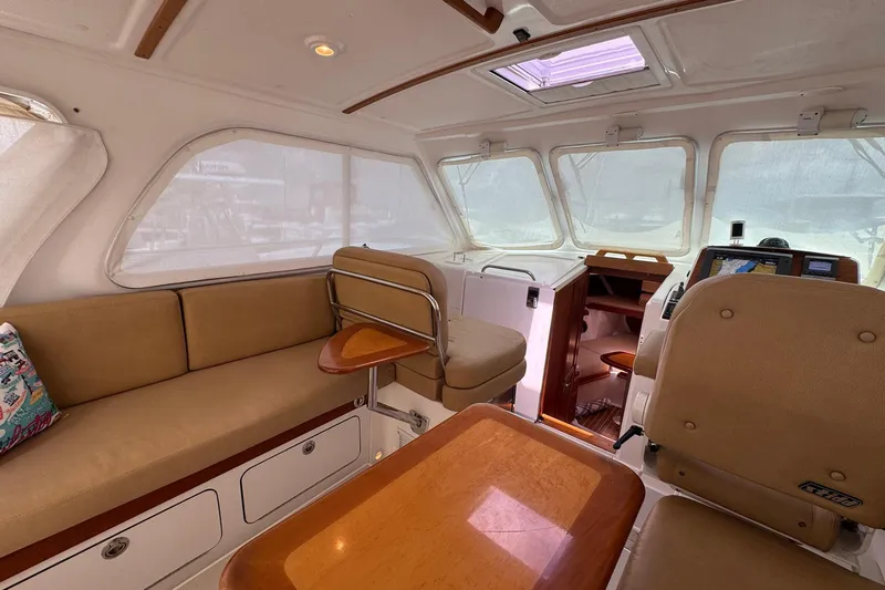 Mary Time Yacht Photos Pics Interior of 2013 Back Cove 30 boat with beige seating and wooden accents.