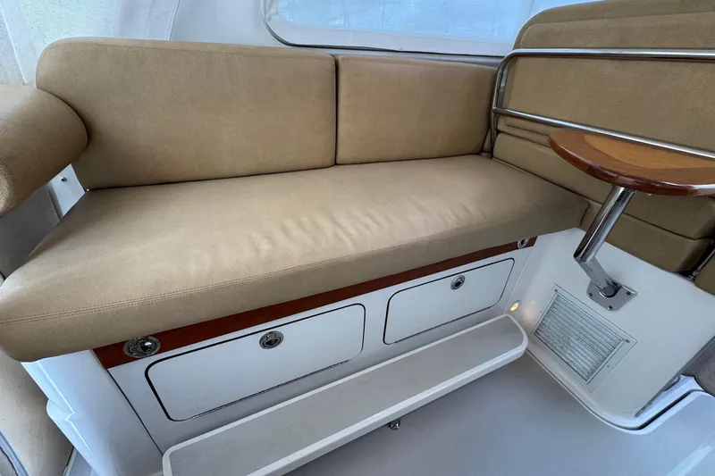 Mary Time Yacht Photos Pics 2013 Back Cove 30 boat interior with beige seating and storage compartments.