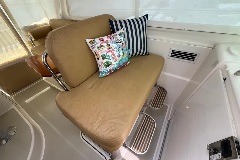 Mary Time Yacht Photos Pics 2013 Back Cove 30 interior with cushioned seating and decorative pillows.