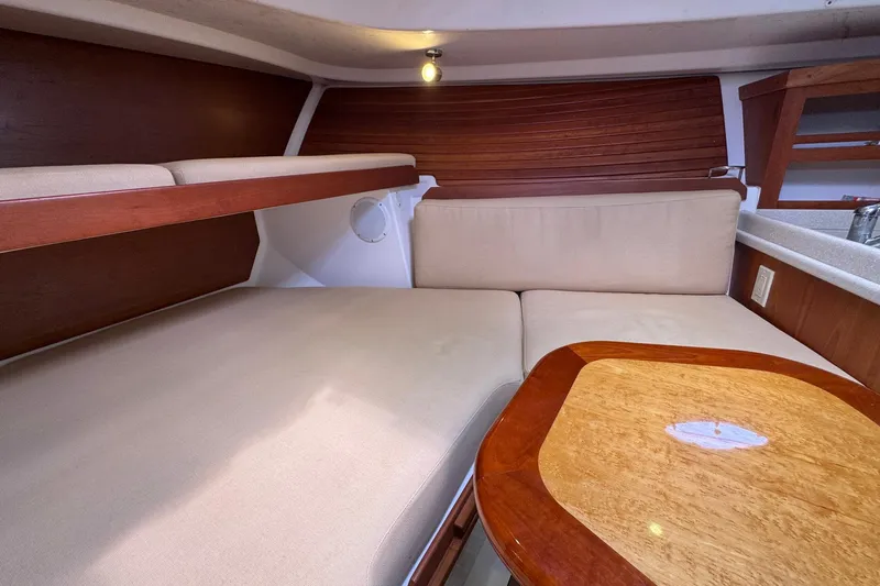 Mary Time Yacht Photos Pics 2013 Back Cove 30 interior with beige seating and wooden accents.