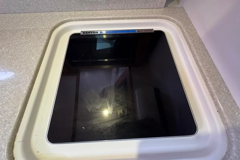 Mary Time Yacht Photos Pics Kenyon alcohol stove on 2013 Back Cove 30 boat, set in a sleek countertop.