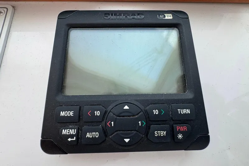 Mary Time Yacht Photos Pics Simrad AP24 autopilot control on 2013 Back Cove 30 boat dashboard.