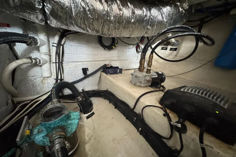 Mary Time Yacht Photos Pics Engine compartment of a 2013 Back Cove 30 boat, showcasing mechanical components and wiring.