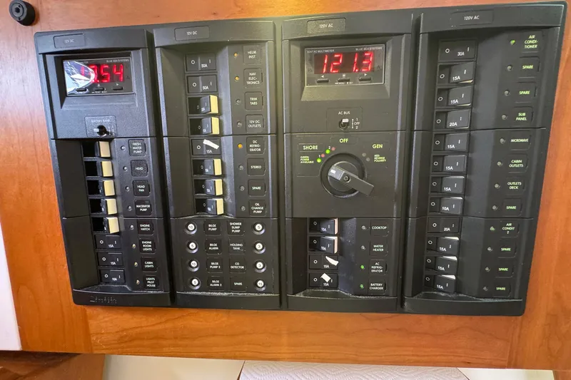 Mary Time Yacht Photos Pics Electrical control panel on a 2013 Back Cove 30 boat, featuring various switches and meters.