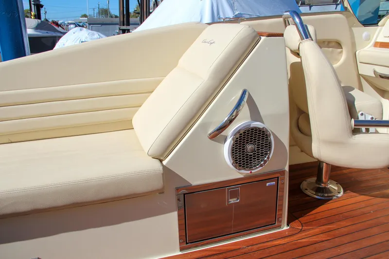  Yacht Photos Pics 2013 Chris-Craft Launch 32 interior with beige seating and wood flooring.