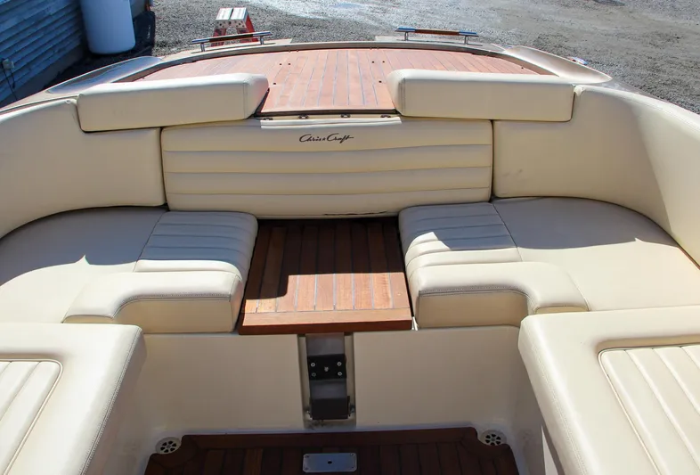  Yacht Photos Pics 2013 Chris-Craft Launch 32 boat interior with beige seating and wooden accents.