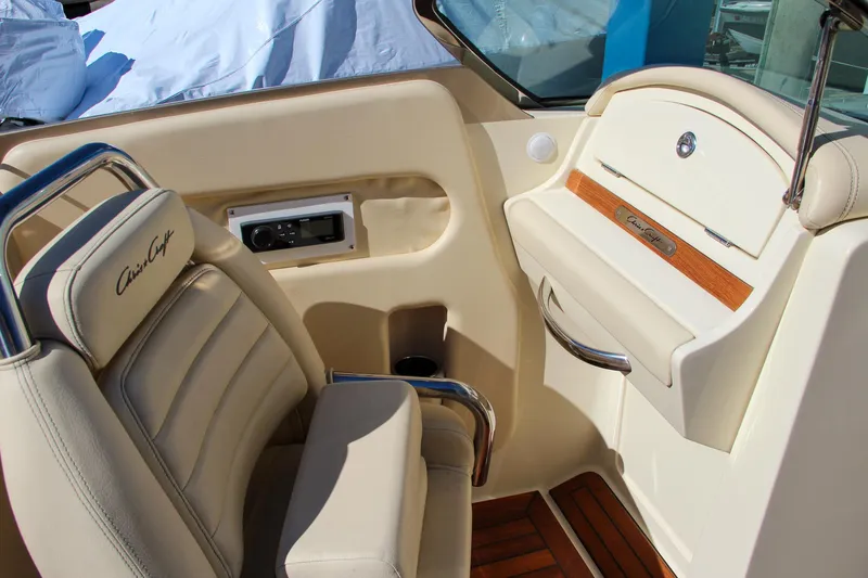  Yacht Photos Pics 2013 Chris-Craft Launch 32 interior with beige seating and wood accents.