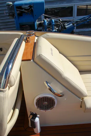  Yacht Photos Pics 2013 Chris-Craft Launch 32 boat interior with beige seating and speaker detail.