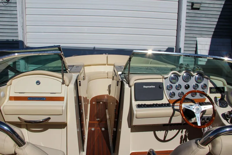  Yacht Photos Pics 2013 Chris-Craft Launch 32 boat interior with dashboard and steering wheel.
