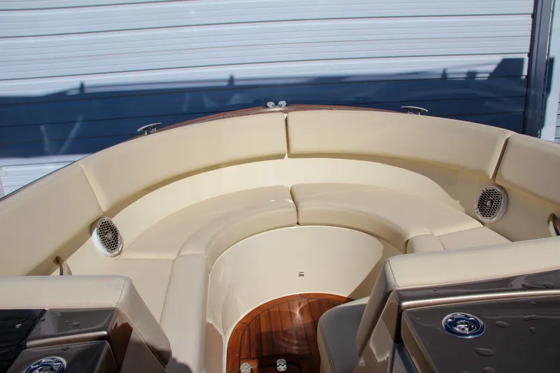  Yacht Photos Pics 2013 Chris-Craft Launch 32 boat interior with beige seating and wood flooring.