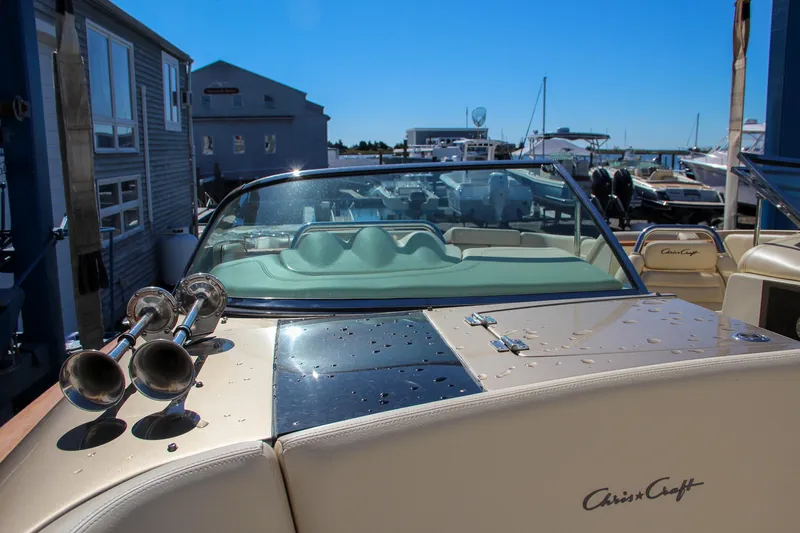  Yacht Photos Pics 2013 Chris-Craft Launch 32 boat with wet deck, docked at marina.
