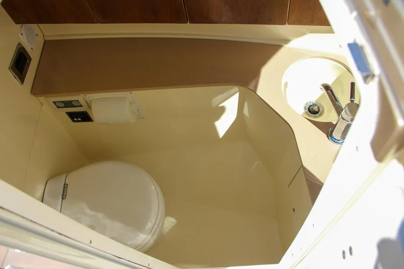  Yacht Photos Pics 2013 Chris-Craft Launch 32 boat bathroom with toilet and sink.