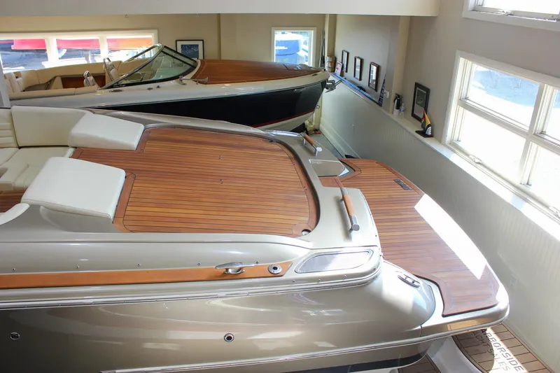  Yacht Photos Pics 2013 Chris-Craft Launch 32 boat with elegant wooden deck in showroom.