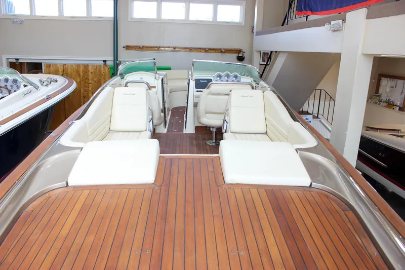  Yacht Photos Pics 2013 Chris-Craft Launch 32 boat interior with teak deck and white seating.