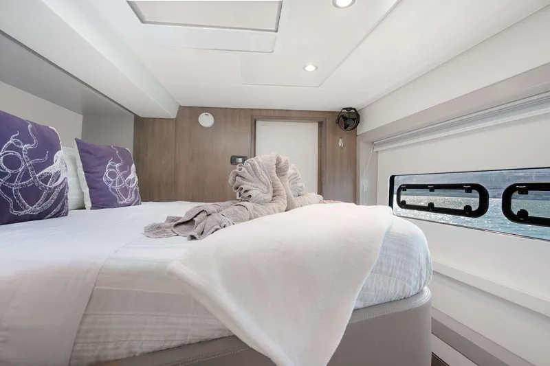  Yacht Photos Pics Luxurious bedroom interior of 2023 Bali 5.4 yacht with modern design and ocean view.