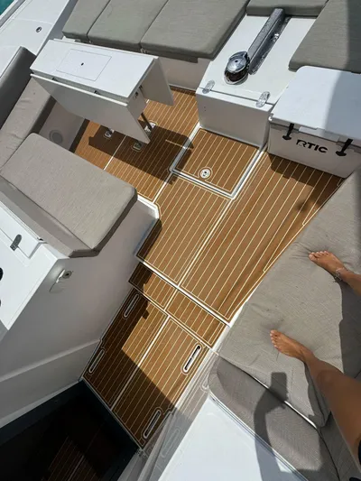  Yacht Photos Pics Bali 5.4 yacht deck with teak flooring and cushioned seating, 2023 model.