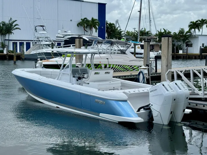  Yacht Photos Pics 2025 Intrepid 345 Nomad FE boat docked with twin Mercury engines.